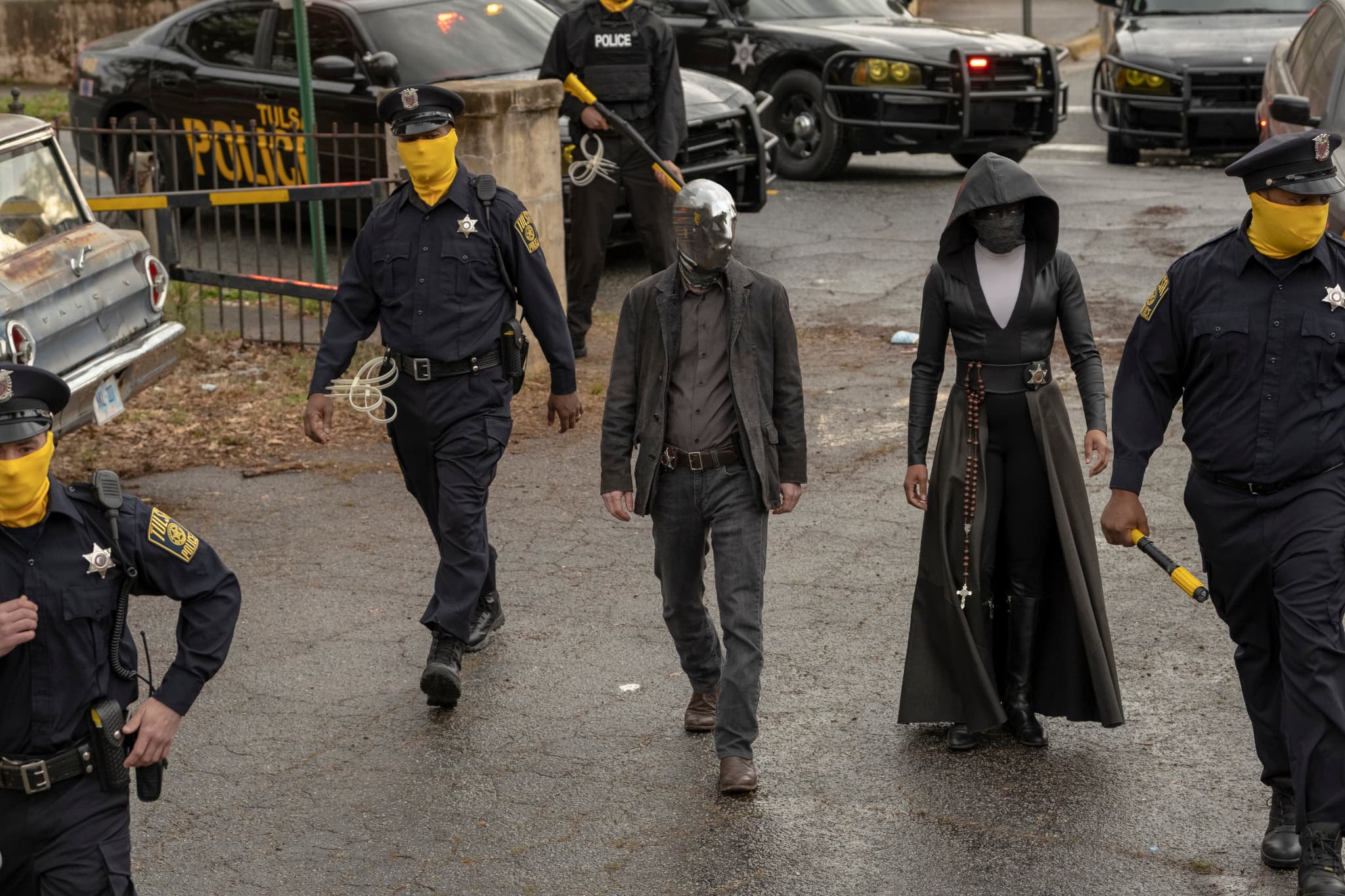 Looking Glass, incarné par Tim Blake Nelson dans Watchmen. Looking Glass, incarné par Tim Blake Nelson dans Watchmen.