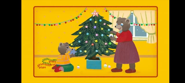 Petit Ours Brun célèbre les fêtes de fin d'année et décore son sapin pour Noël.