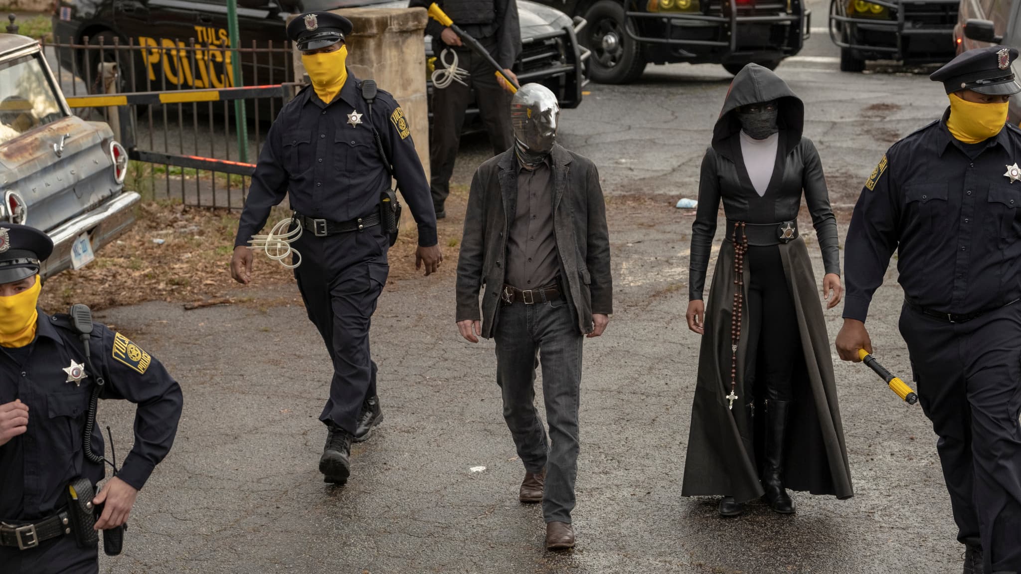 Looking Glass, incarné par Tim Blake Nelson dans Watchmen. Looking Glass, incarné par Tim Blake Nelson dans Watchmen.