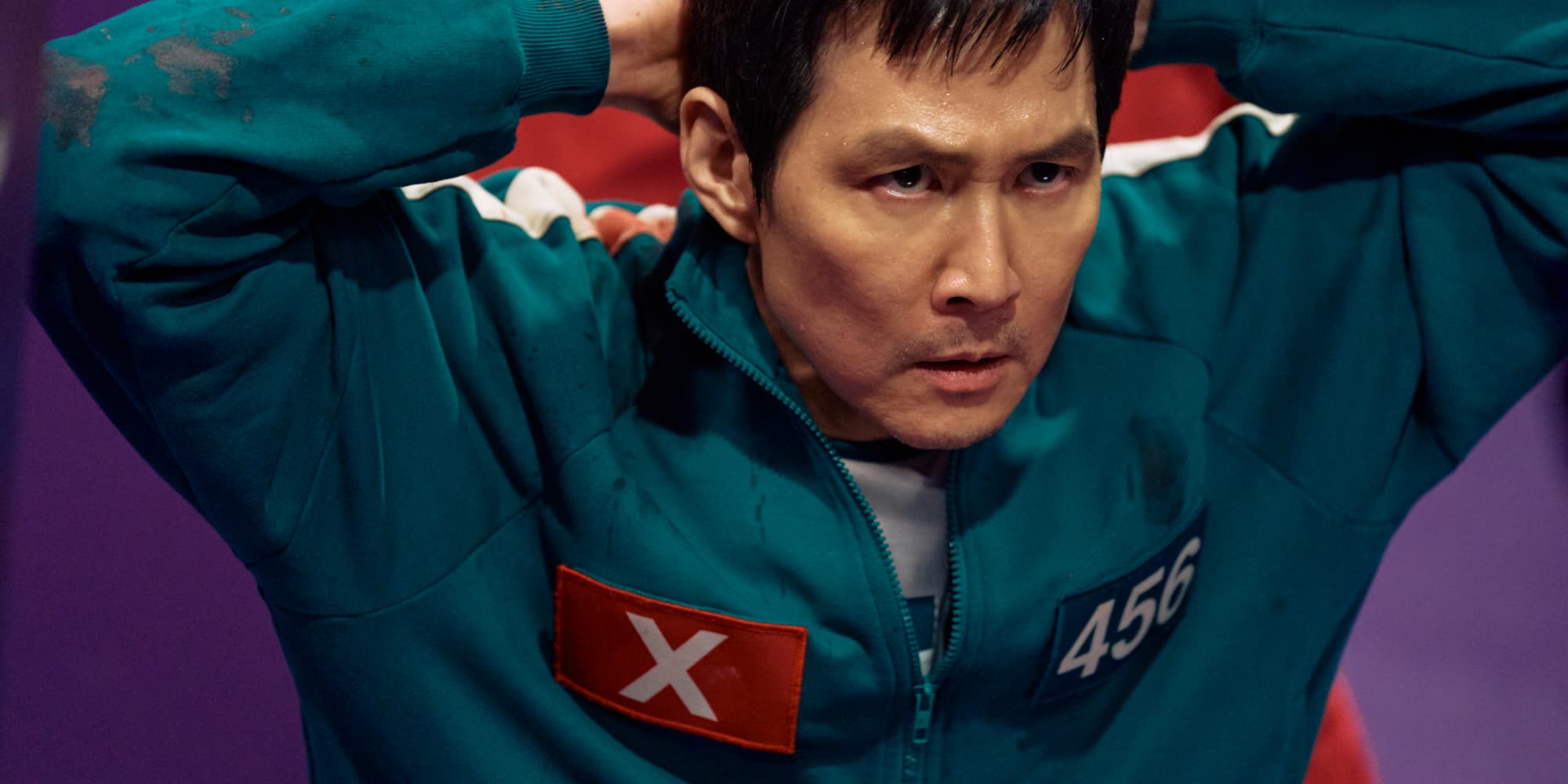 Retrouvez Lee Jung-jae dans le rôle de Gi-Hun dans la saison 2 de ''Squid Game'', disponible sur Netflix.